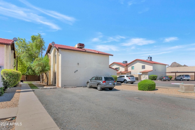 view of side of property with cooling unit