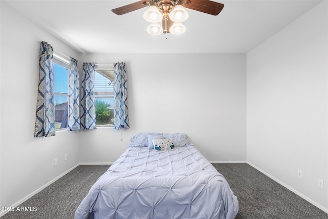 bedroom with baseboards, carpet, and a ceiling fan