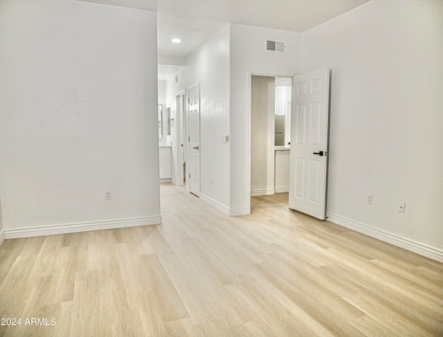 unfurnished room with light hardwood / wood-style flooring