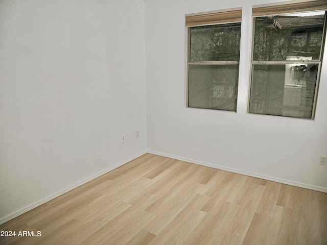 unfurnished room featuring light hardwood / wood-style flooring