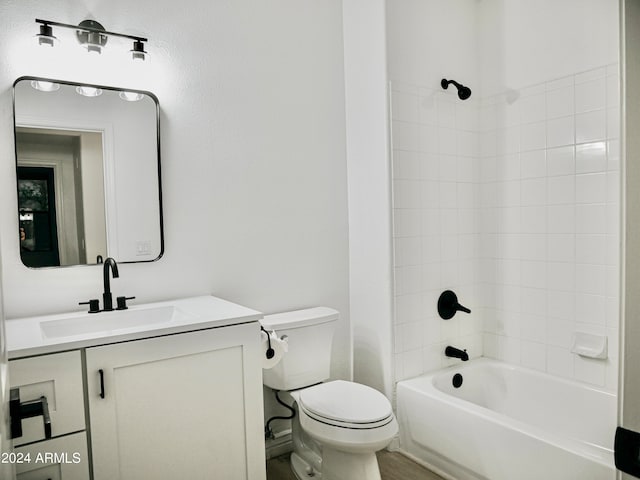 full bathroom with vanity, toilet, and tiled shower / bath