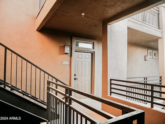 entrance to property with a balcony