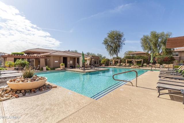 view of swimming pool featuring a patio and a pergola