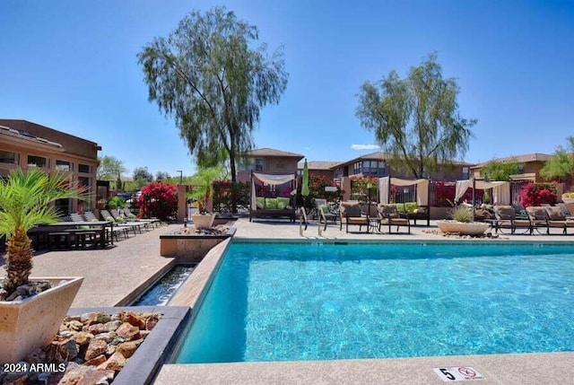 view of swimming pool featuring a patio