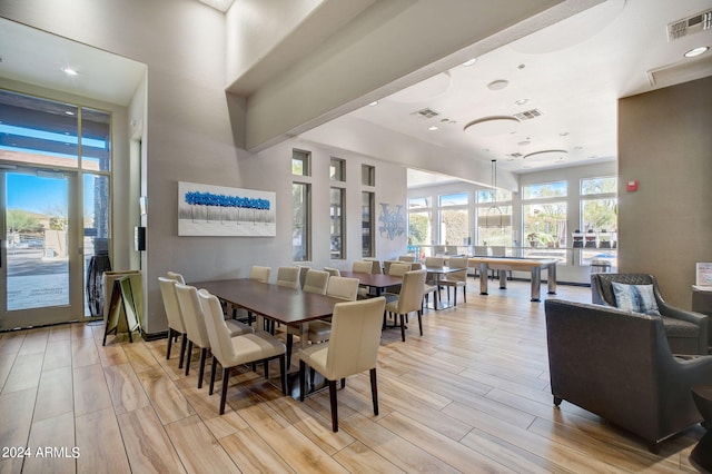 dining space with light hardwood / wood-style flooring