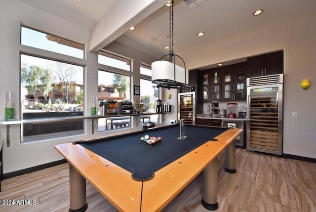 rec room featuring beamed ceiling, light wood-type flooring, billiards, and beverage cooler