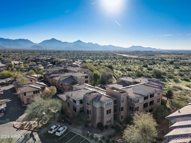 birds eye view of property with a mountain view