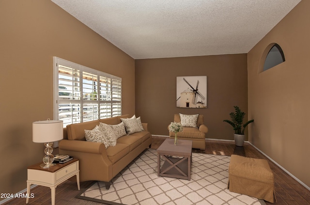 living room featuring light hardwood / wood-style floors and a textured ceiling