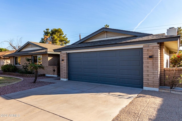 ranch-style house featuring a garage