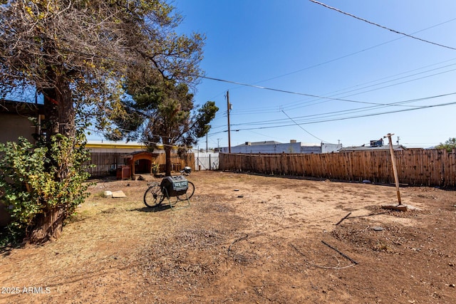 view of yard with a fenced backyard