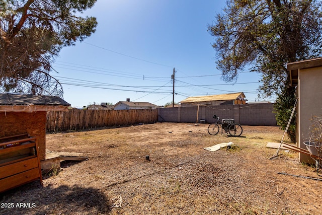 view of yard with a fenced backyard