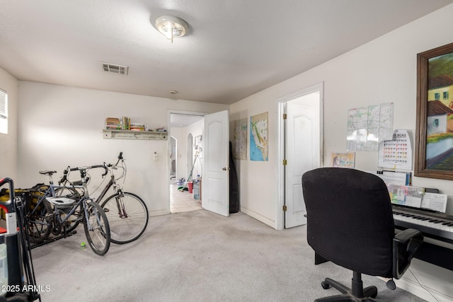 home office featuring visible vents, arched walkways, light colored carpet, and baseboards