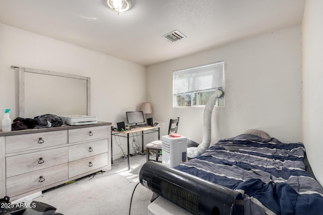 bedroom featuring visible vents and light colored carpet