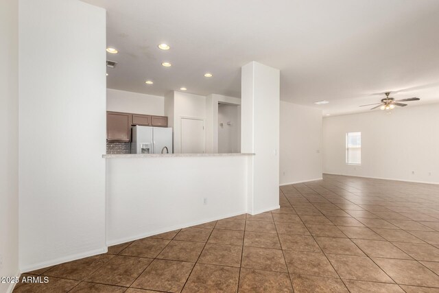 2556 W Amber Sun Dr, Phoenix, AZ 85085 - unfurnished living room featuring recessed lighting, tile patterned floors, and a ceiling fan
