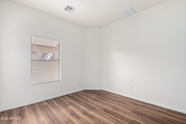 2556 W Amber Sun Dr, Phoenix, AZ 85085 - unfurnished room featuring wood finished floors and baseboards