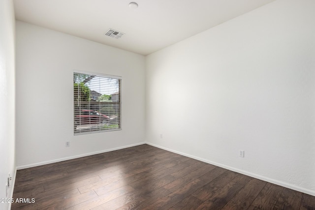 2556 W Amber Sun Dr, Phoenix, AZ 85085 - unfurnished room featuring dark wood-style flooring and baseboards