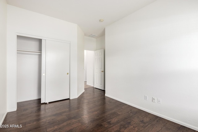 2556 W Amber Sun Dr, Phoenix, AZ 85085 - unfurnished bedroom with dark wood-type flooring and a closet