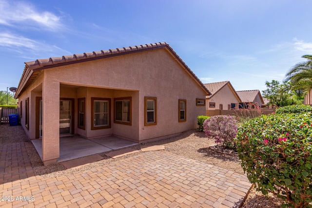 2556 W Amber Sun Dr, Phoenix, AZ 85085 - back of house with a patio and stucco siding
