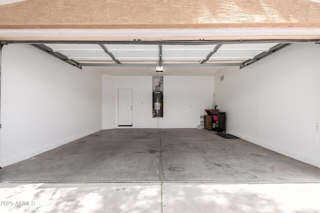 2556 W Amber Sun Dr, Phoenix, AZ 85085 - garage featuring water heater and a garage door opener