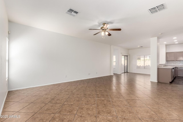 2556 W Amber Sun Dr, Phoenix, AZ 85085 - unfurnished living room featuring ceiling fan, recessed lighting, and light tile patterned flooring