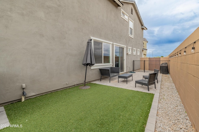 rear view of property with a patio area and a lawn