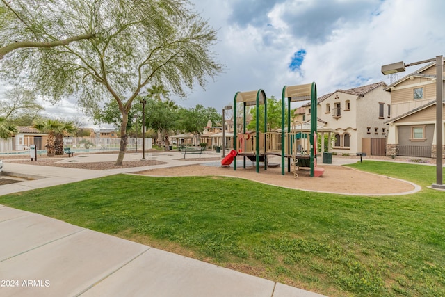 view of play area featuring a lawn