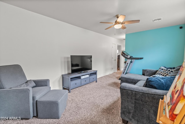 living room featuring ceiling fan and light colored carpet