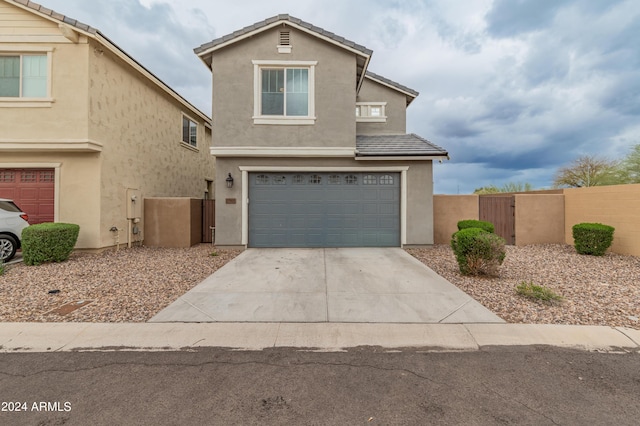 front facade with a garage