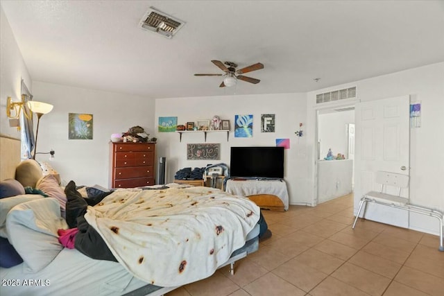 bedroom featuring visible vents, ceiling fan, and light tile patterned floors