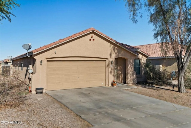 mediterranean / spanish-style home with a garage