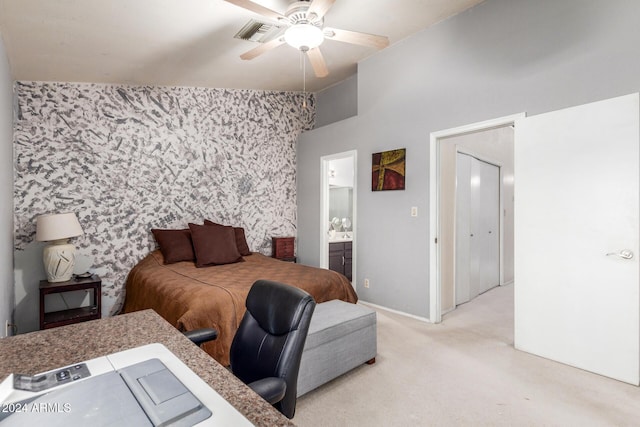 bedroom with visible vents, an accent wall, light carpet, baseboards, and wallpapered walls