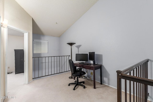 office with lofted ceiling, carpet flooring, and baseboards