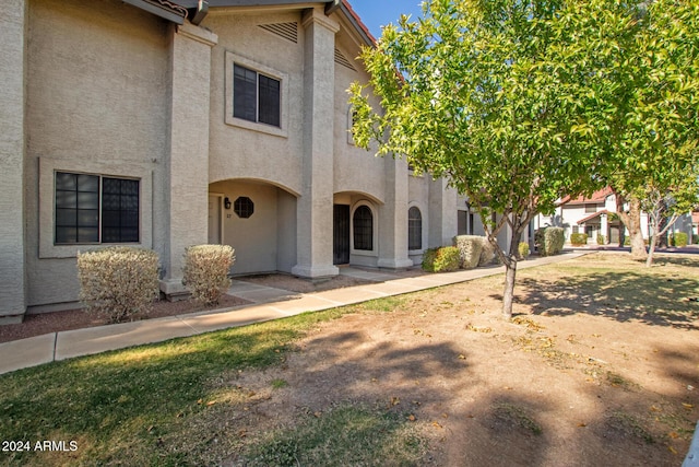 view of property featuring stucco siding