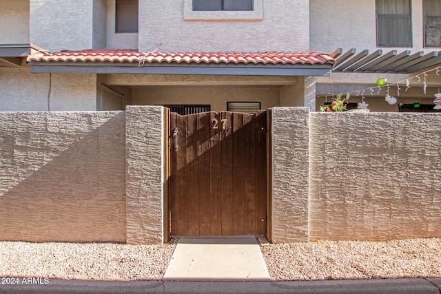 view of gate with fence