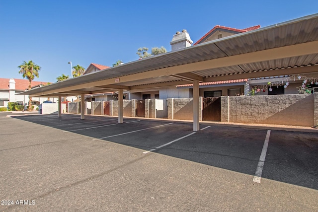 covered parking lot with fence