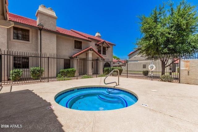 view of swimming pool featuring fence