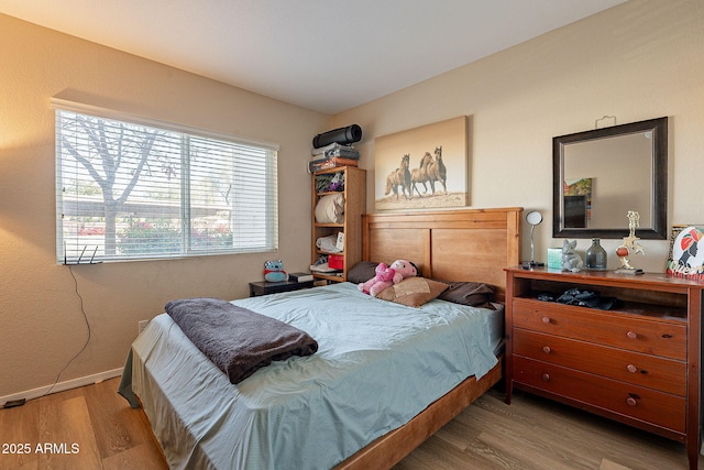 1825 W Ray Rd Unit 1068, Chandler, AZ 85224 - bedroom with baseboards and wood finished floors