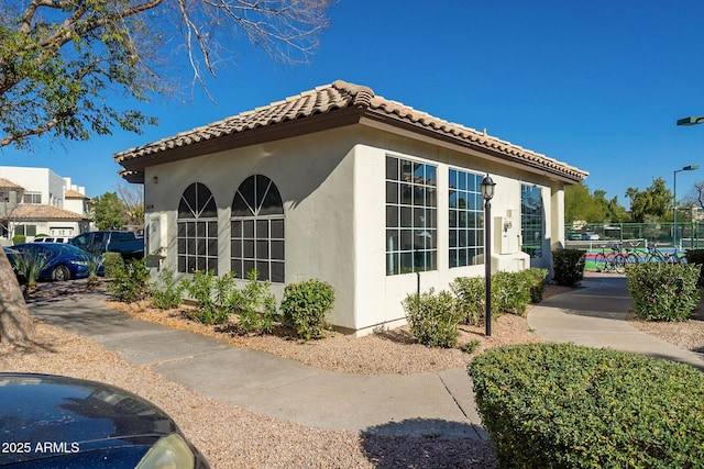 1825 W Ray Rd Unit 1068, Chandler, AZ 85224 - view of property exterior featuring stucco siding and a tile roof