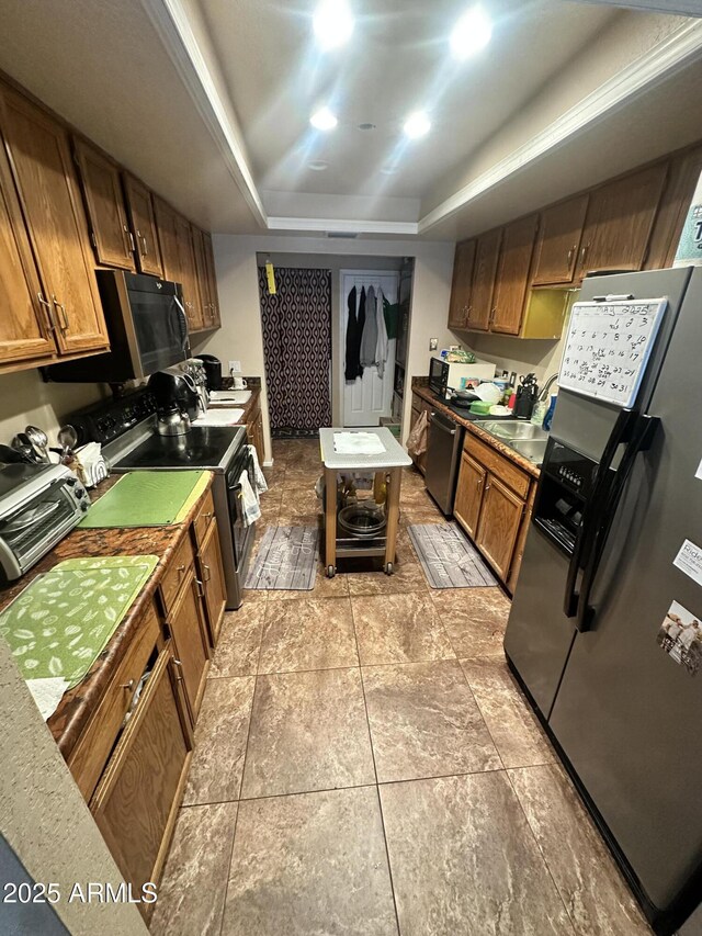 14402 N Saguaro Blvd Unit A, Fountain Hills, AZ 85268 - kitchen with appliances with stainless steel finishes, a raised ceiling, and brown cabinets