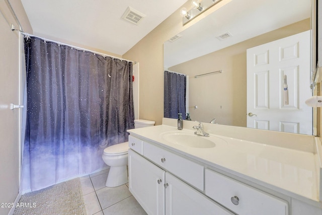 bathroom featuring visible vents, vanity, toilet, and tile patterned floors