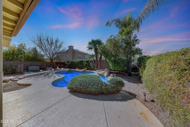 view of pool with a patio area, a fenced backyard, and a fenced in pool