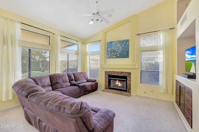 living room featuring baseboards, light colored carpet, ceiling fan, a fireplace, and high vaulted ceiling