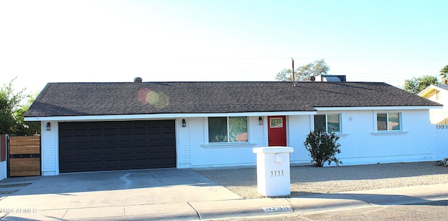 single story home featuring a garage