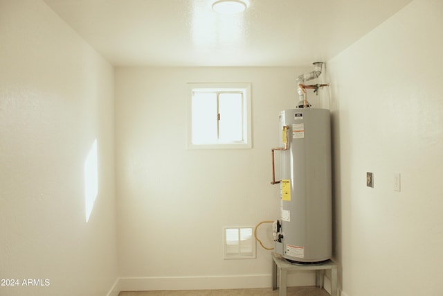 utility room with water heater