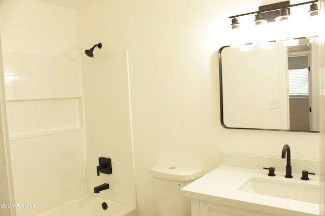 full bathroom featuring toilet, vanity, and tub / shower combination