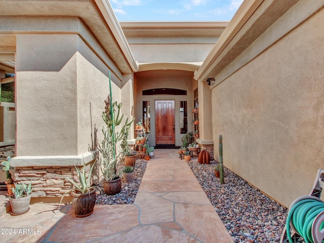 3220 W Feather Sound Dr, Anthem, AZ 85086 - entrance to property featuring a patio, stucco siding, and stone siding
