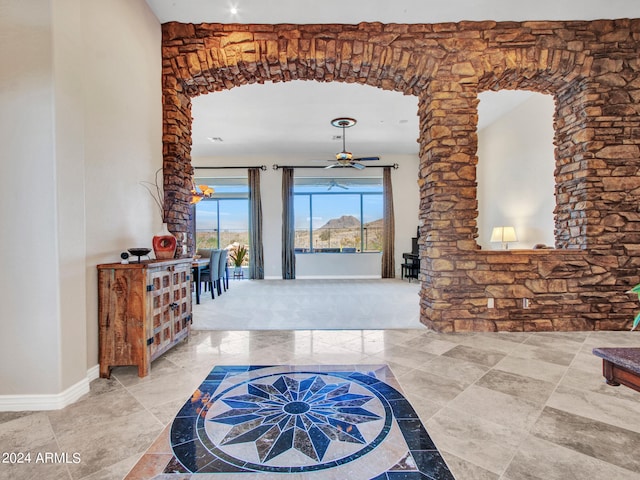 entrance foyer featuring ceiling fan