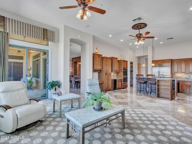 3220 W Feather Sound Dr, Anthem, AZ 85086 - living room featuring recessed lighting, arched walkways, visible vents, and a ceiling fan