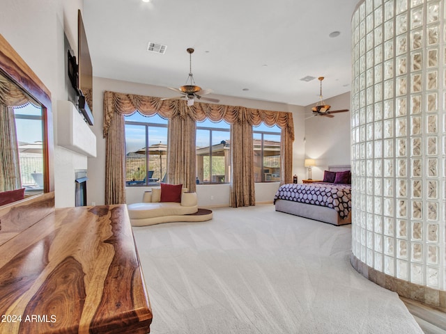 carpeted bedroom with a fireplace