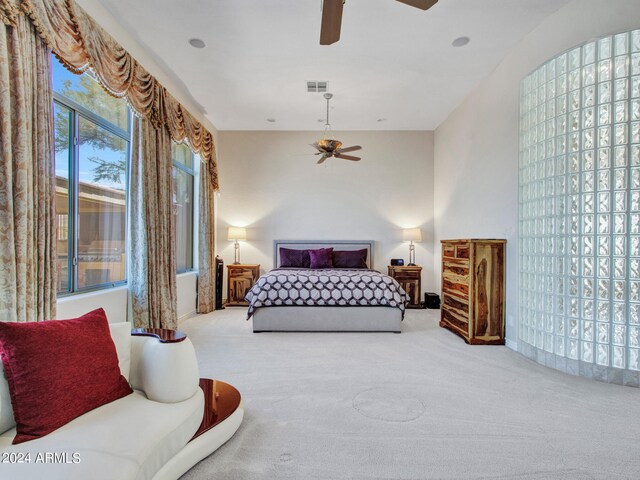 carpeted bedroom featuring ceiling fan